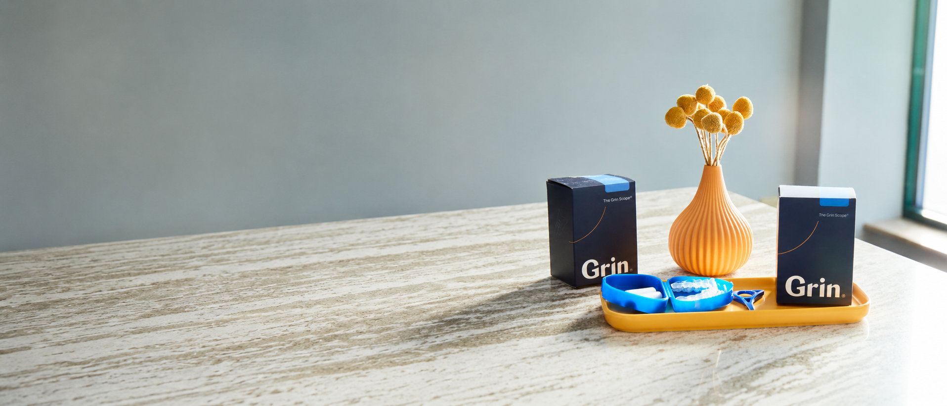 Patient using the Grin Scope for a remote orthodontic scan
