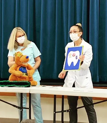 Dr. Rocha teaching a local kindergarten class about oral health